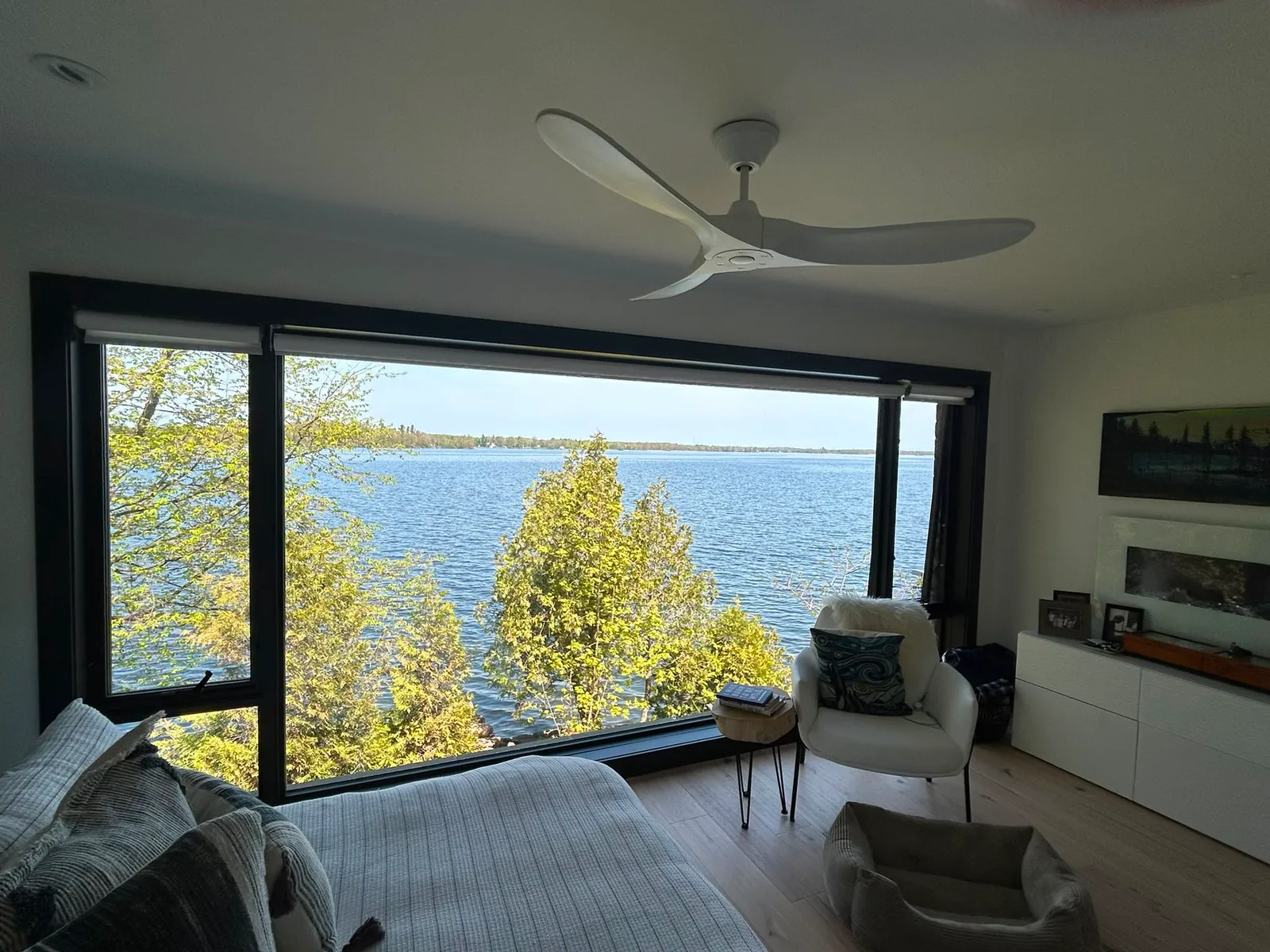 A freshly painted lakeside bedroom by McIntosh Painting & Maintenance